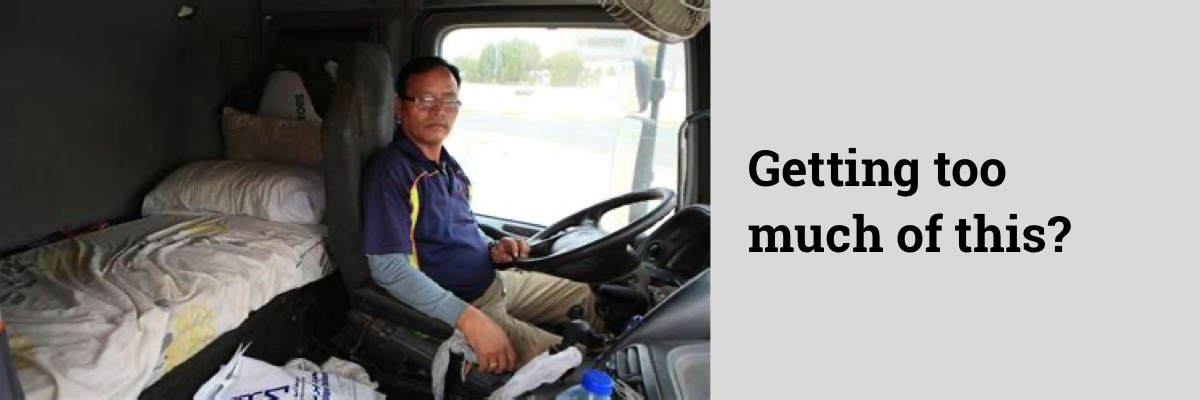 man in truck with bed in the background